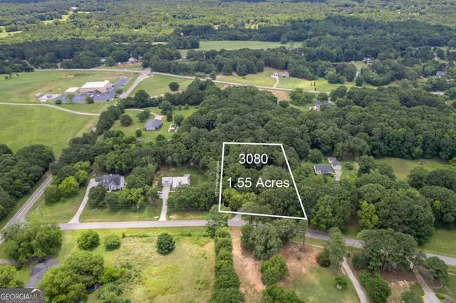 a view of a wooden house with a yard