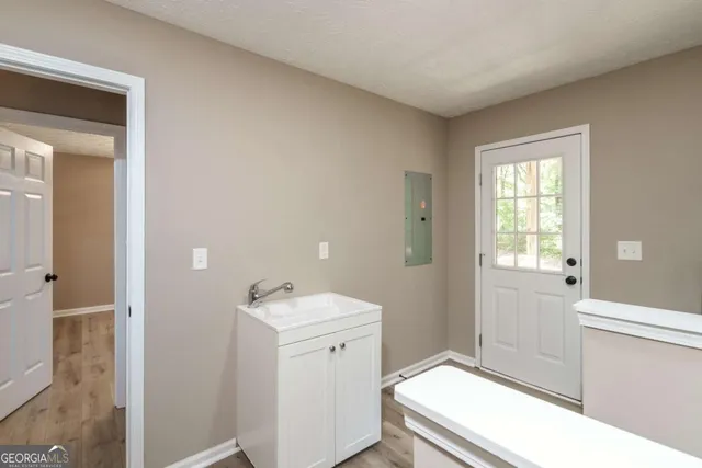 a bathroom with a sink toilet and vanity