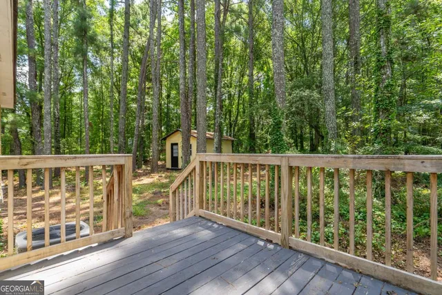 a view of balcony with wooden fence