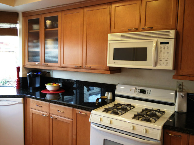 277 Michigan Road Milpitas, CA 95035 - Photo 4 of 25 a kitchen with stainless steel appliances granite countertop cabinets and a stove top oven