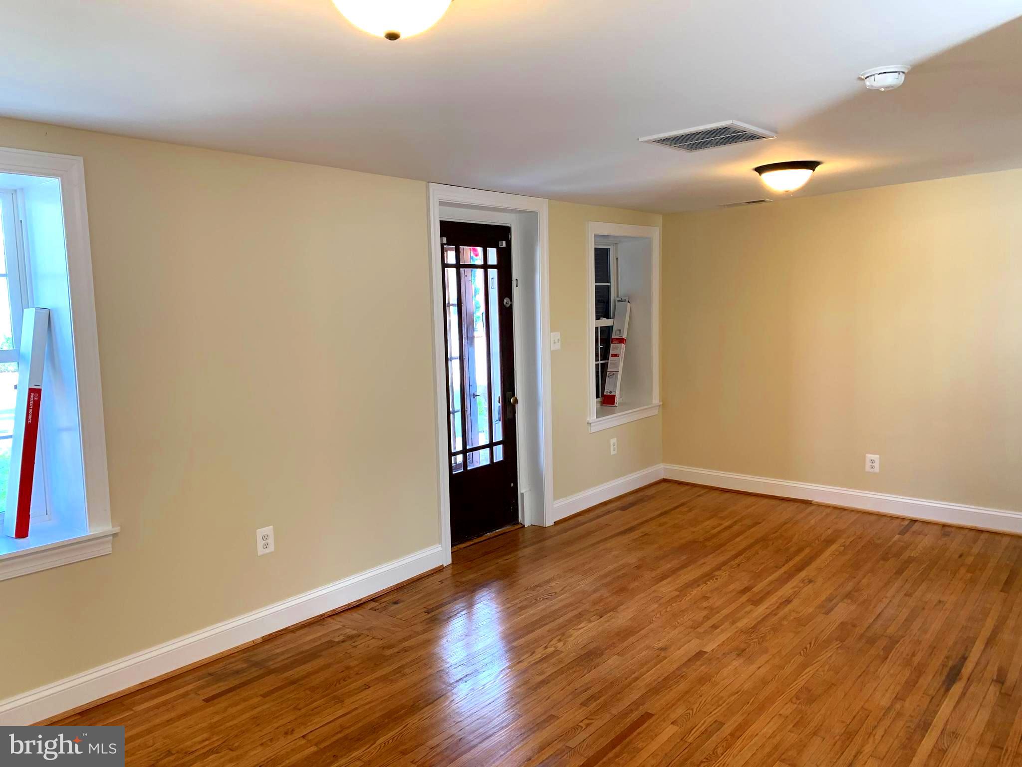 116 North Main Street Boonsboro, MD 21713 - Photo 11 of 44 a view of an empty room with wooden floor and a window
