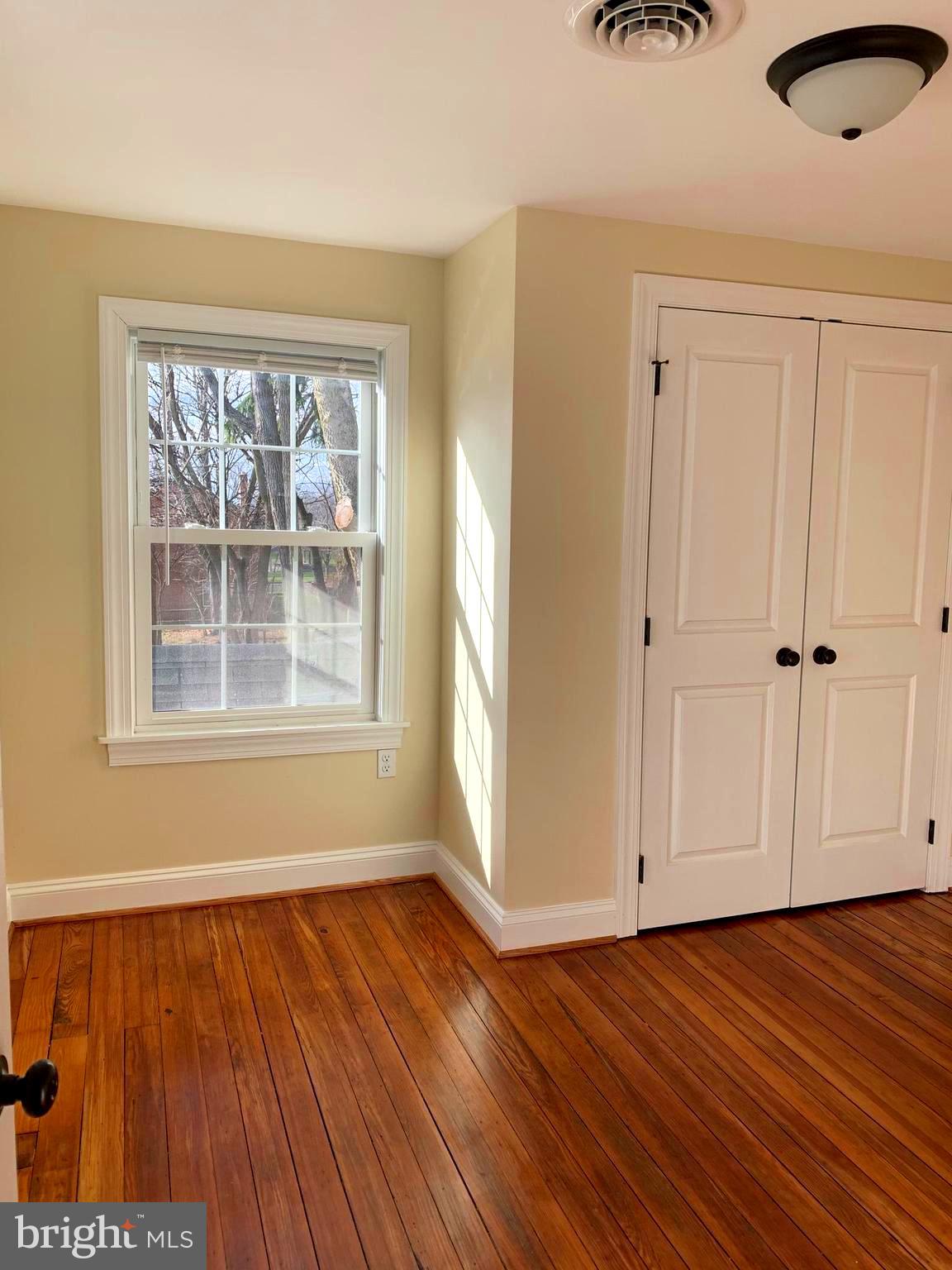 116 North Main Street Boonsboro, MD 21713 - Photo 25 of 44 an empty room with wooden floor and windows