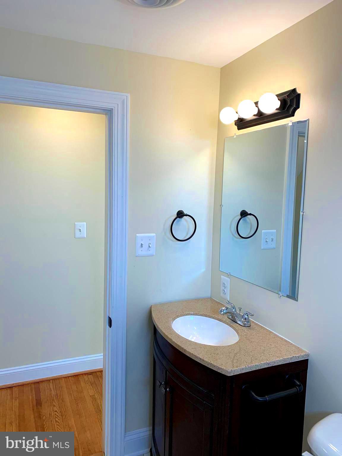 116 North Main Street Boonsboro, MD 21713 - Photo 26 of 44 a bathroom with a sink and a mirror