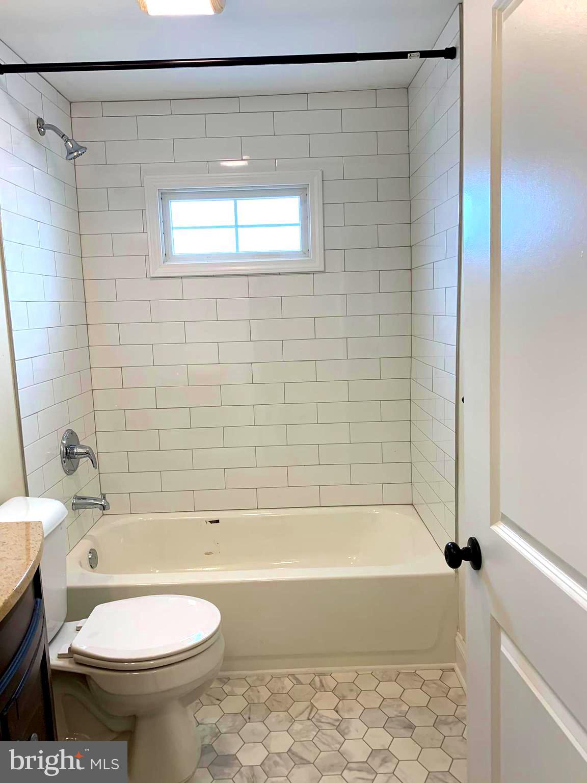 116 North Main Street Boonsboro, MD 21713 - Photo 28 of 44 a bathroom with a toilet and a bath tub