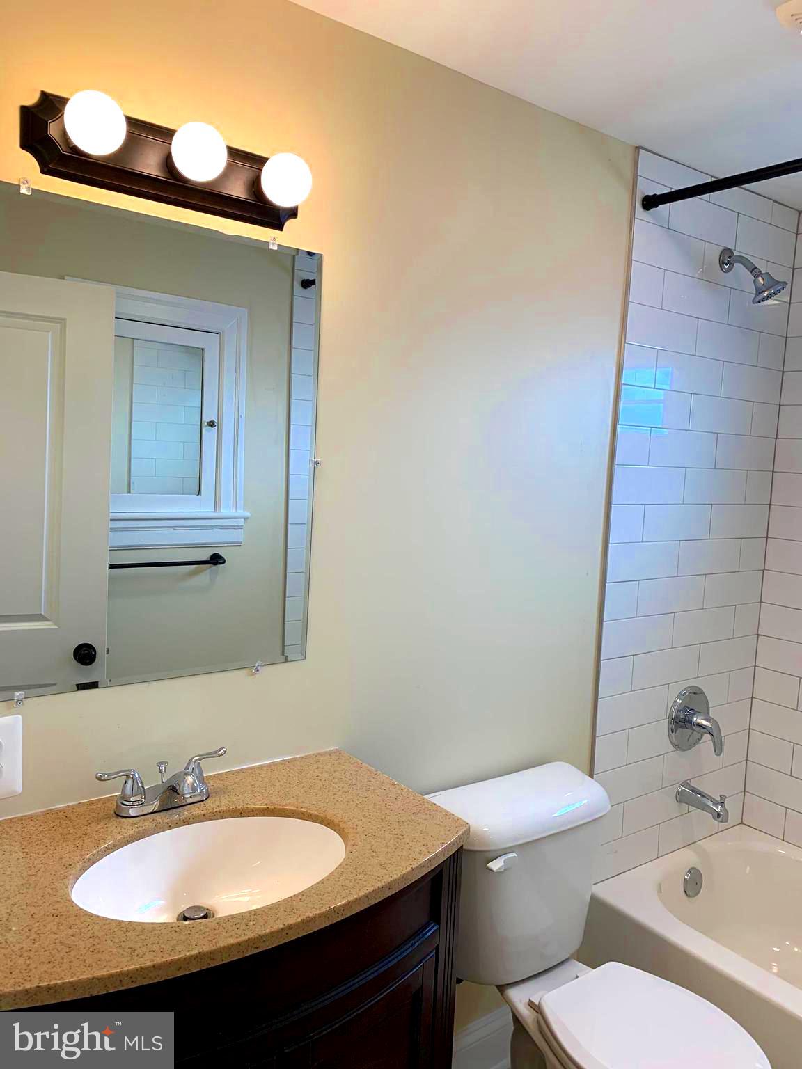 116 North Main Street Boonsboro, MD 21713 - Photo 29 of 44 a bathroom with a sink a toilet and shower