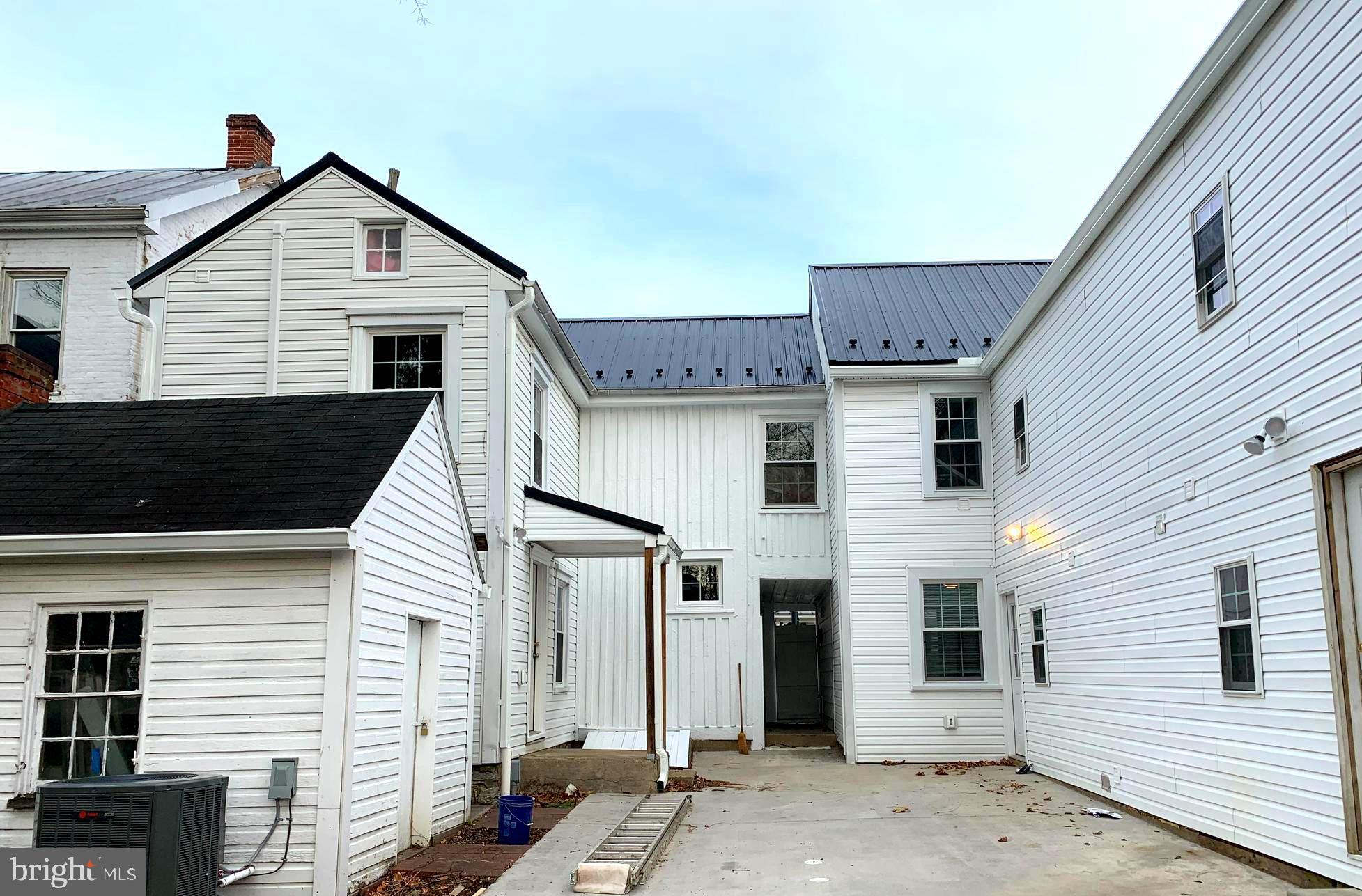 116 North Main Street Boonsboro, MD 21713 - Photo 3 of 44 a view of a white house with black roof
