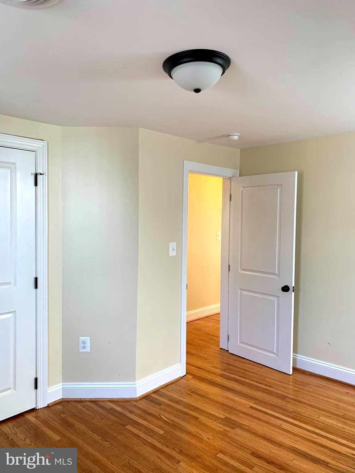 116 North Main Street Boonsboro, MD 21713 - Photo 31 of 44 an empty room with wooden floor and closet
