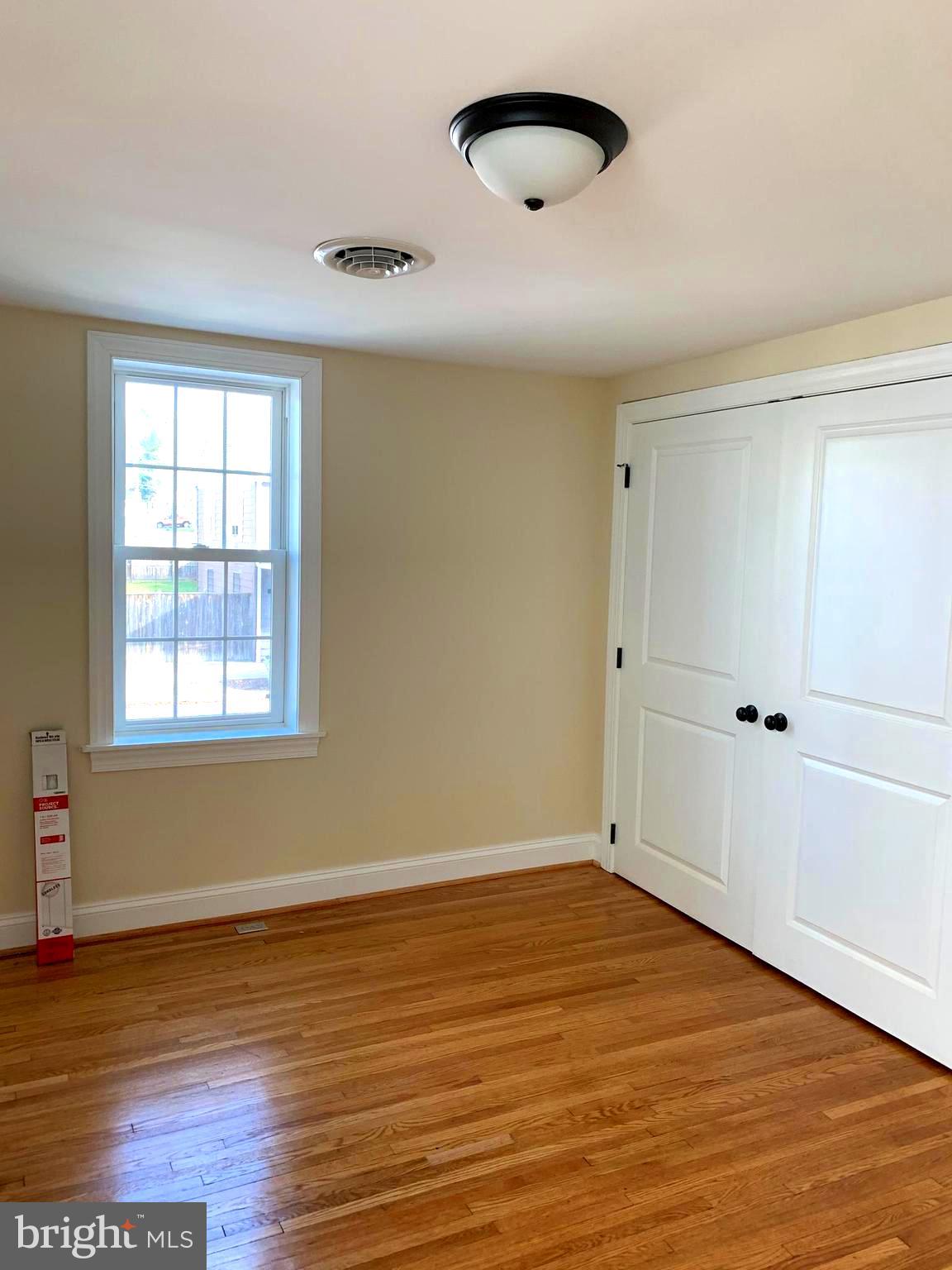 116 North Main Street Boonsboro, MD 21713 - Photo 34 of 44 an empty room with wooden floor and windows