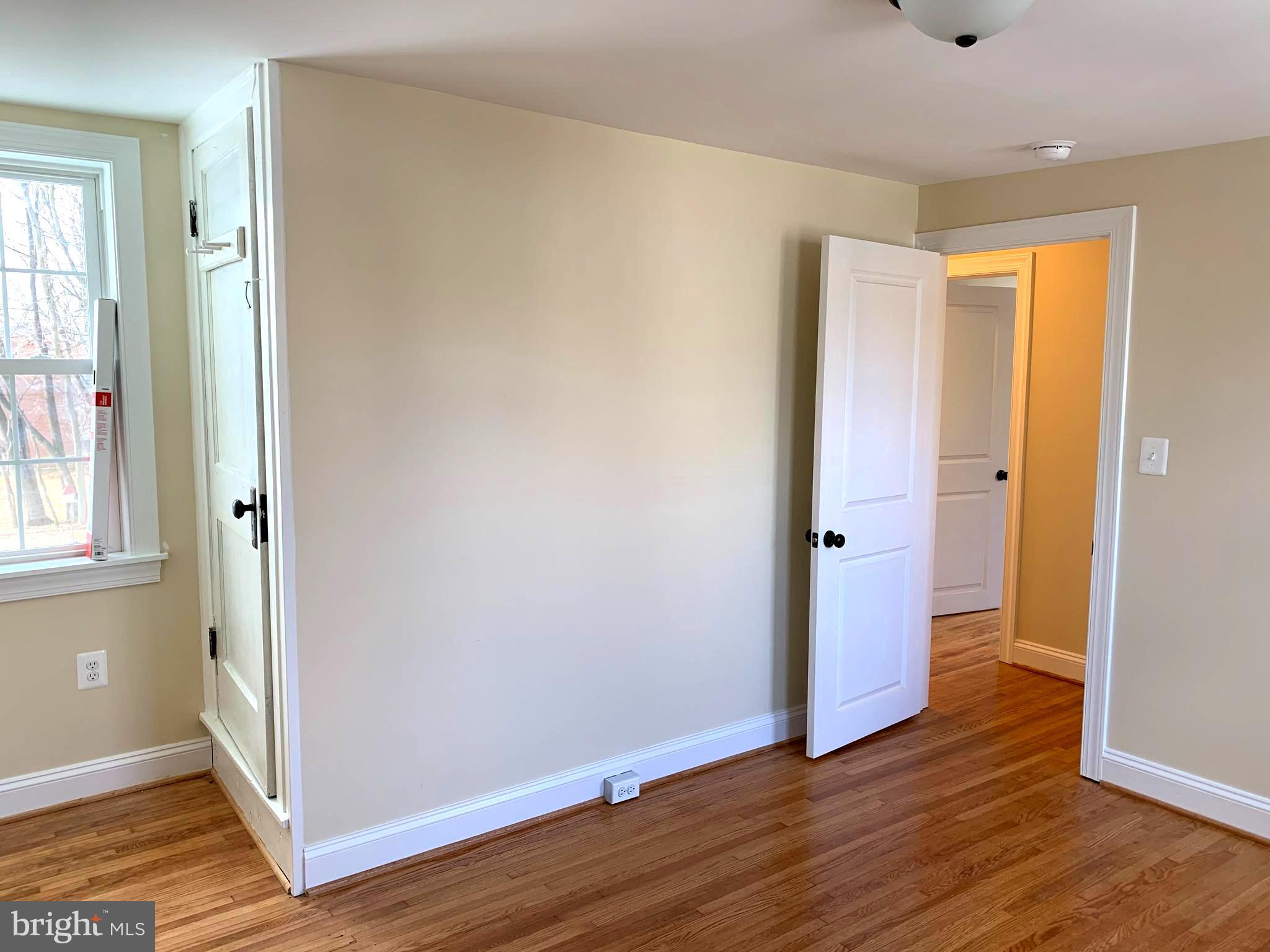 116 North Main Street Boonsboro, MD 21713 - Photo 41 of 44 an empty room with wooden floor and windows