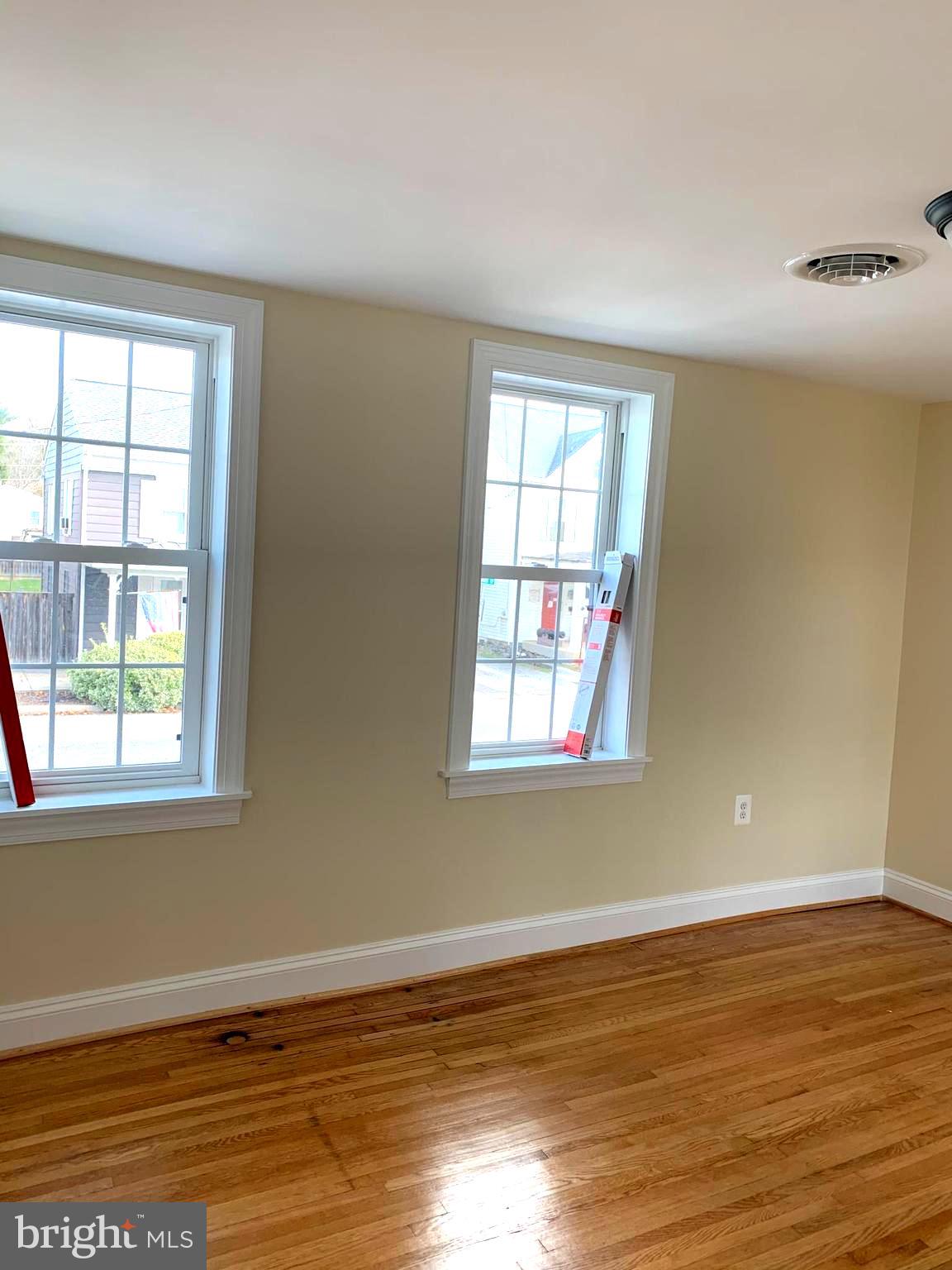 116 North Main Street Boonsboro, MD 21713 - Photo 44 of 44 a view of an empty room with wooden floor and a window