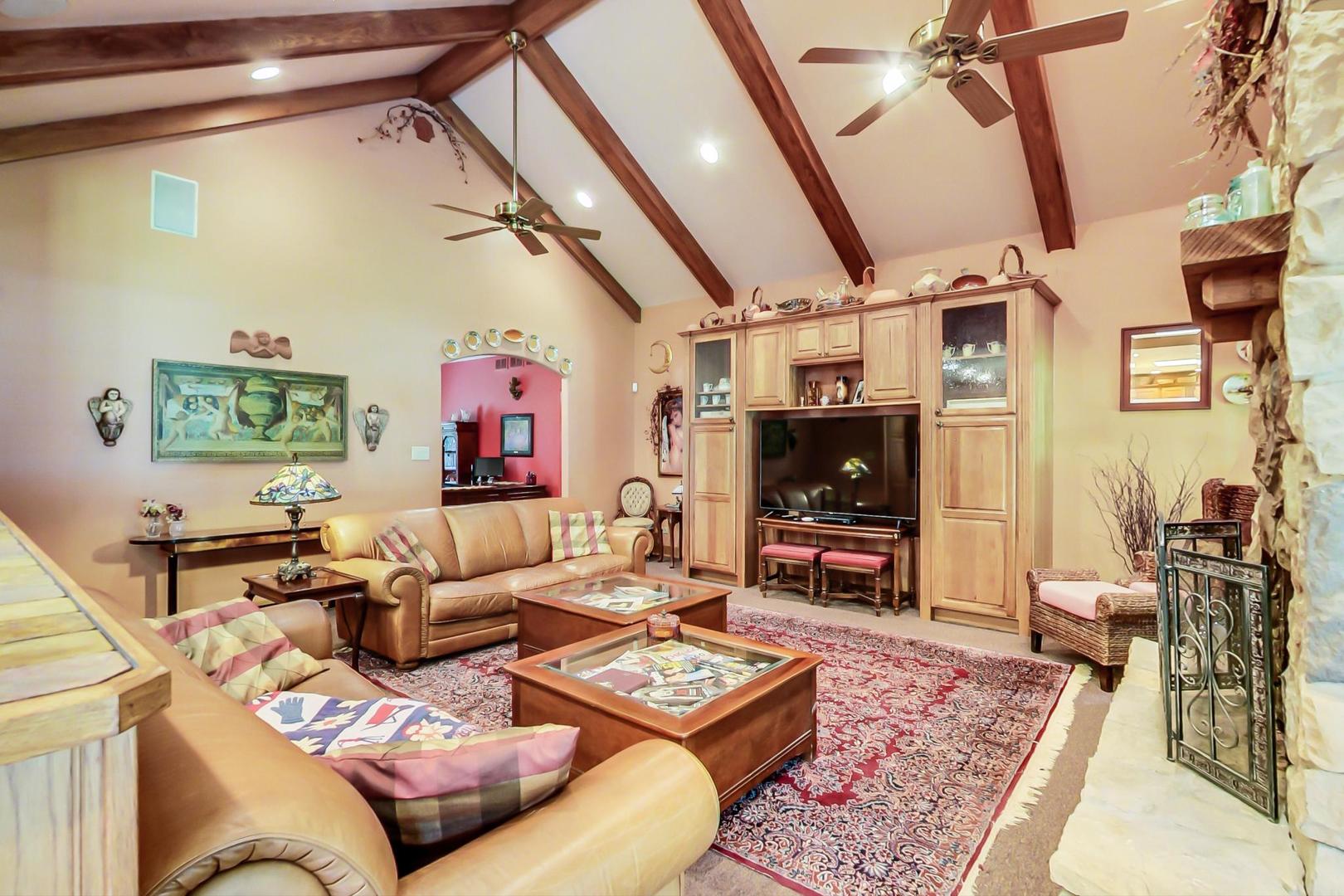 8901 Maple Avenue Burr Ridge, IL 60527 - Photo 17 of 68 a living room with furniture and a flat screen tv