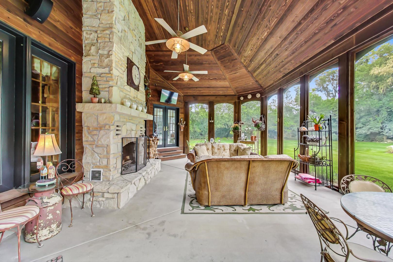 8901 Maple Avenue Burr Ridge, IL 60527 - Photo 18 of 68 a living room with fireplace furniture and a large window