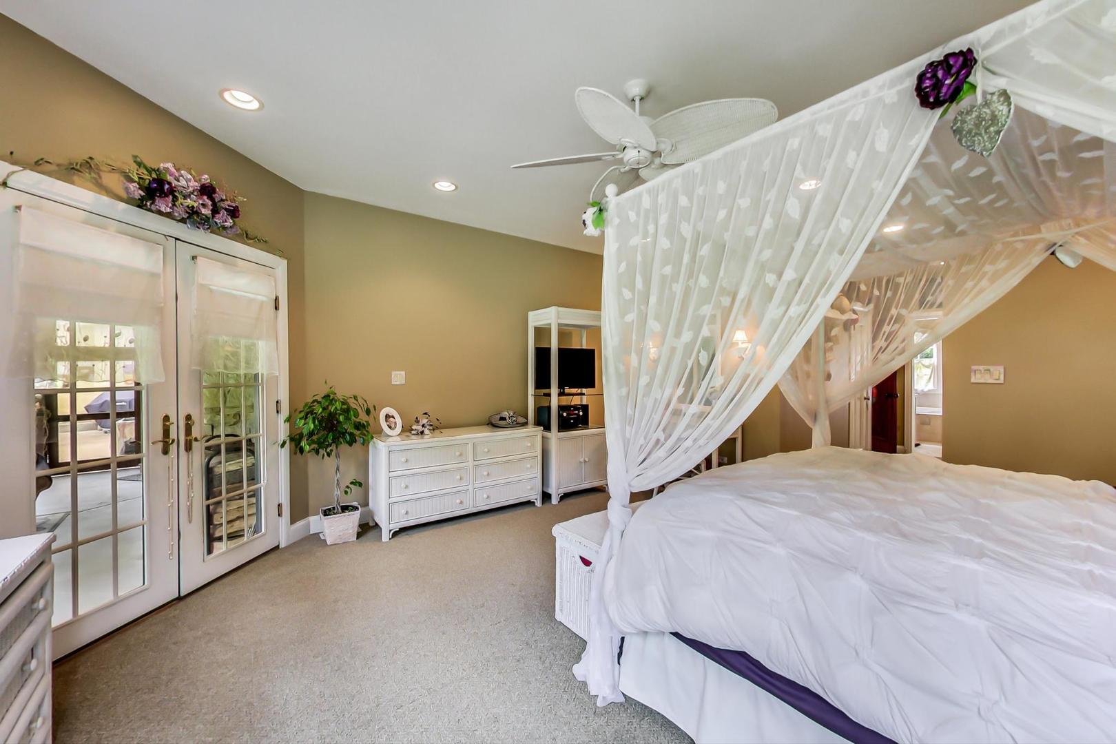 8901 Maple Avenue Burr Ridge, IL 60527 - Photo 23 of 68 a spacious bedroom with a bed and a large window