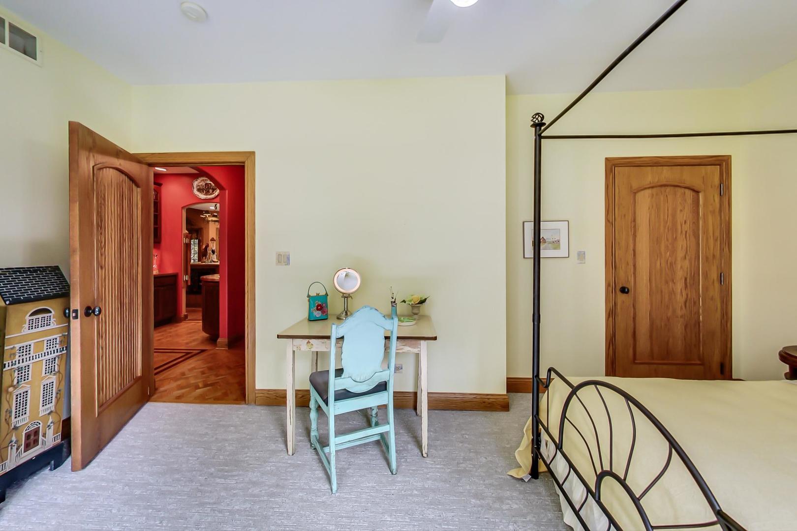 8901 Maple Avenue Burr Ridge, IL 60527 - Photo 28 of 68 a bedroom with a bed and a table