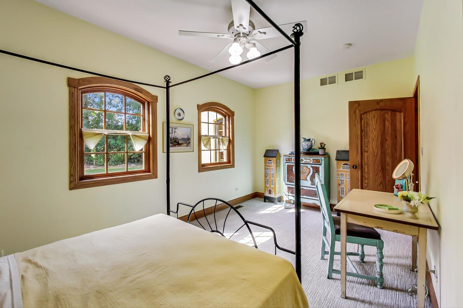 8901 Maple Avenue Burr Ridge, IL 60527 - Photo 29 of 68 a bedroom with furniture and a window