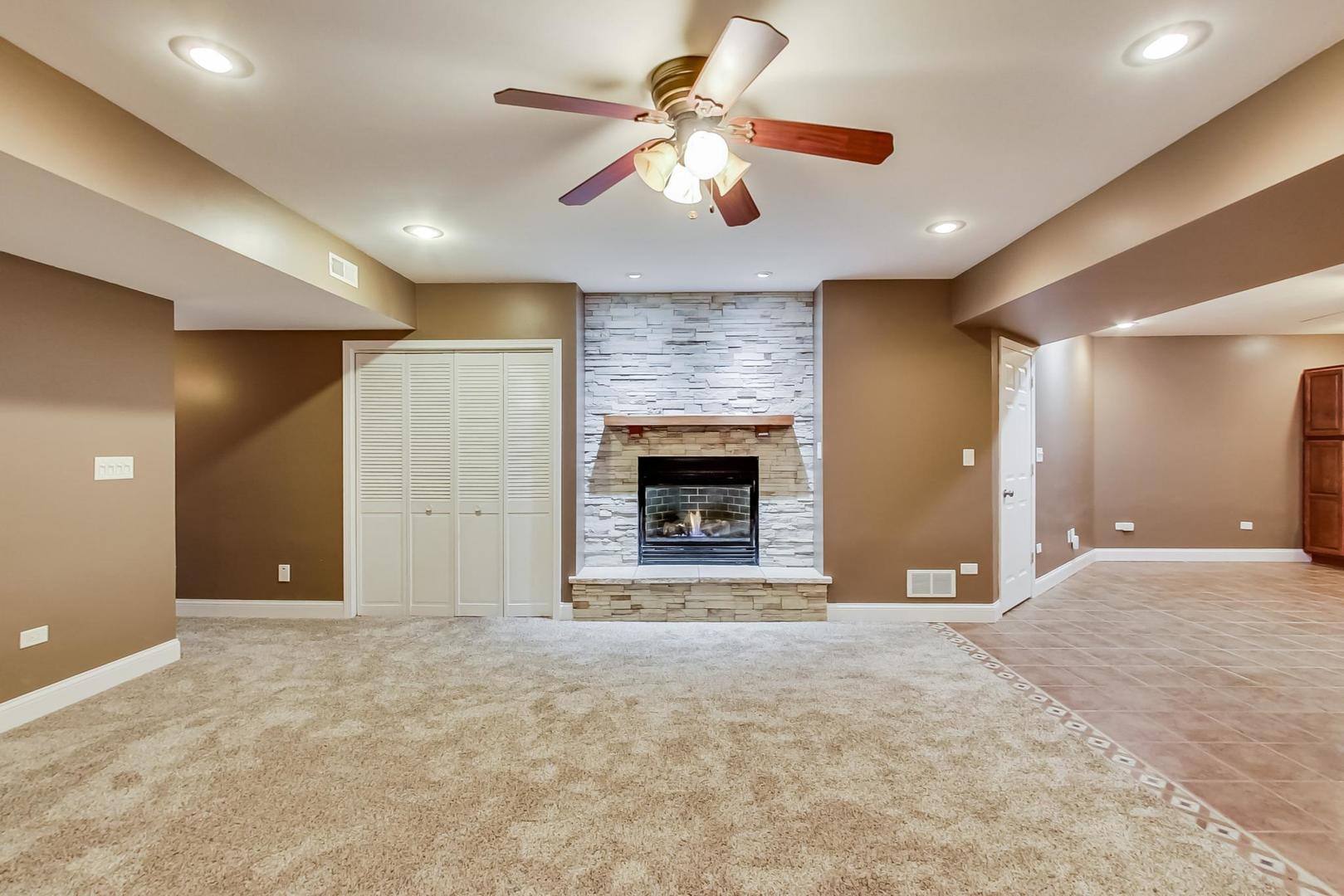8901 Maple Avenue Burr Ridge, IL 60527 - Photo 37 of 68 a view of an empty room with a fireplace