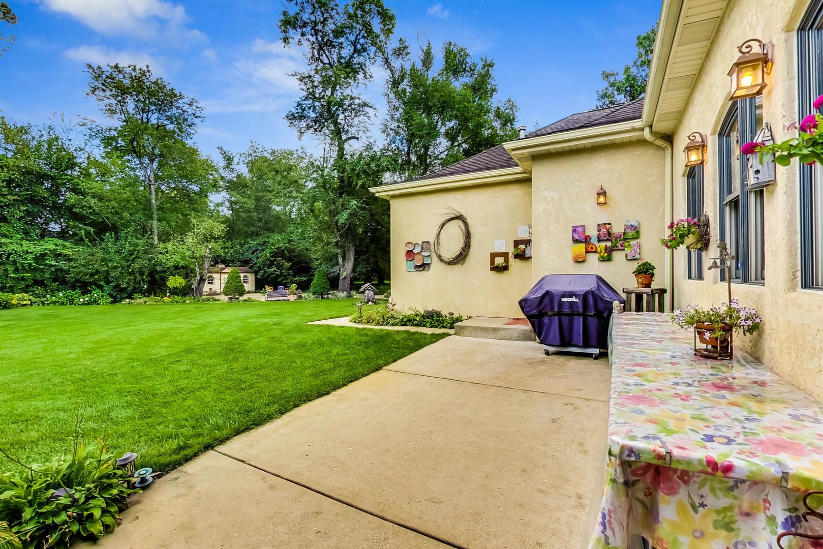 8901 Maple Avenue Burr Ridge, IL 60527 - Photo 56 of 68 a view of a house with a patio