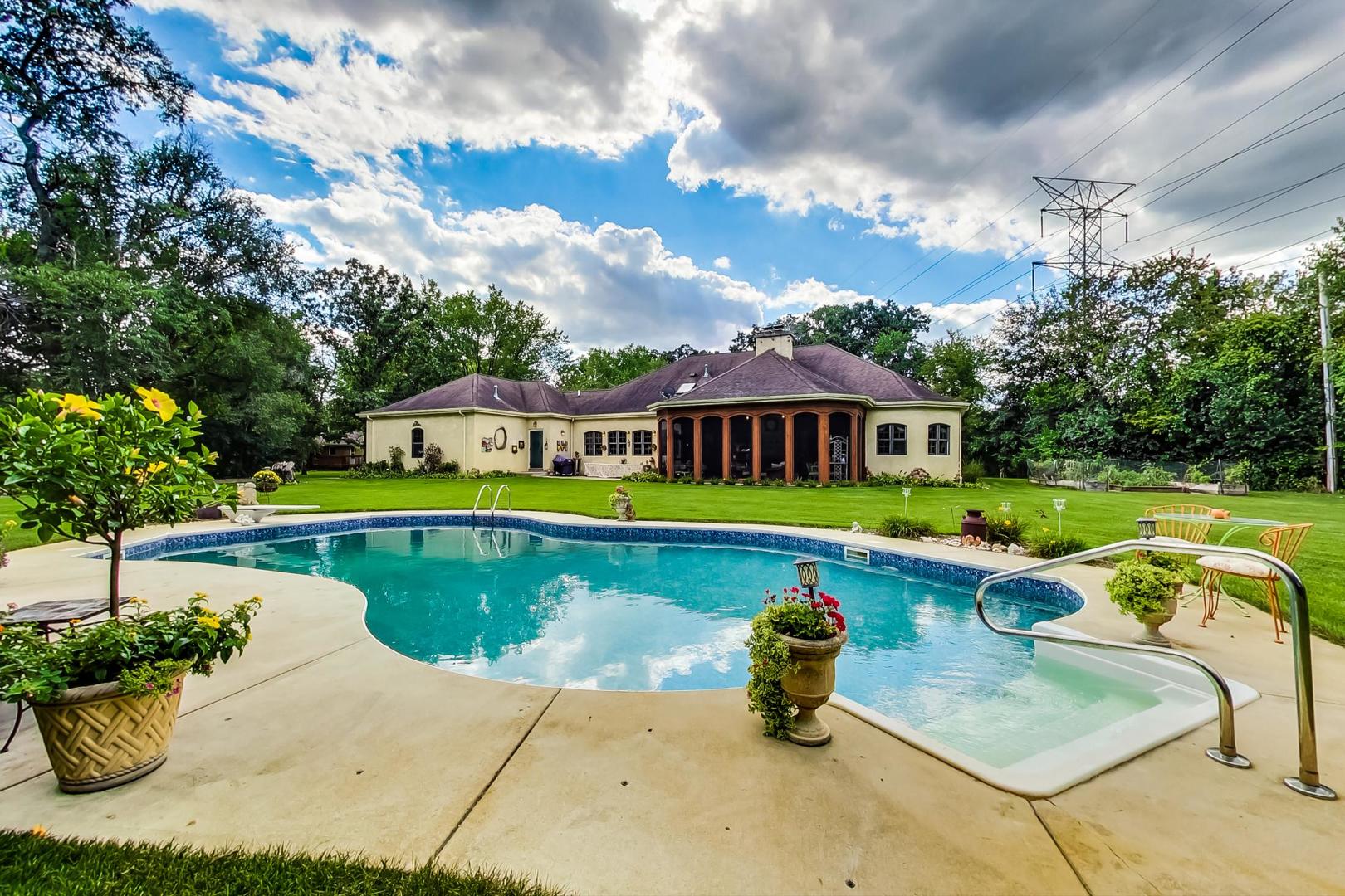 8901 Maple Avenue Burr Ridge, IL 60527 - Photo 58 of 68 a swimming pool with outdoor seating yard and barbeque oven