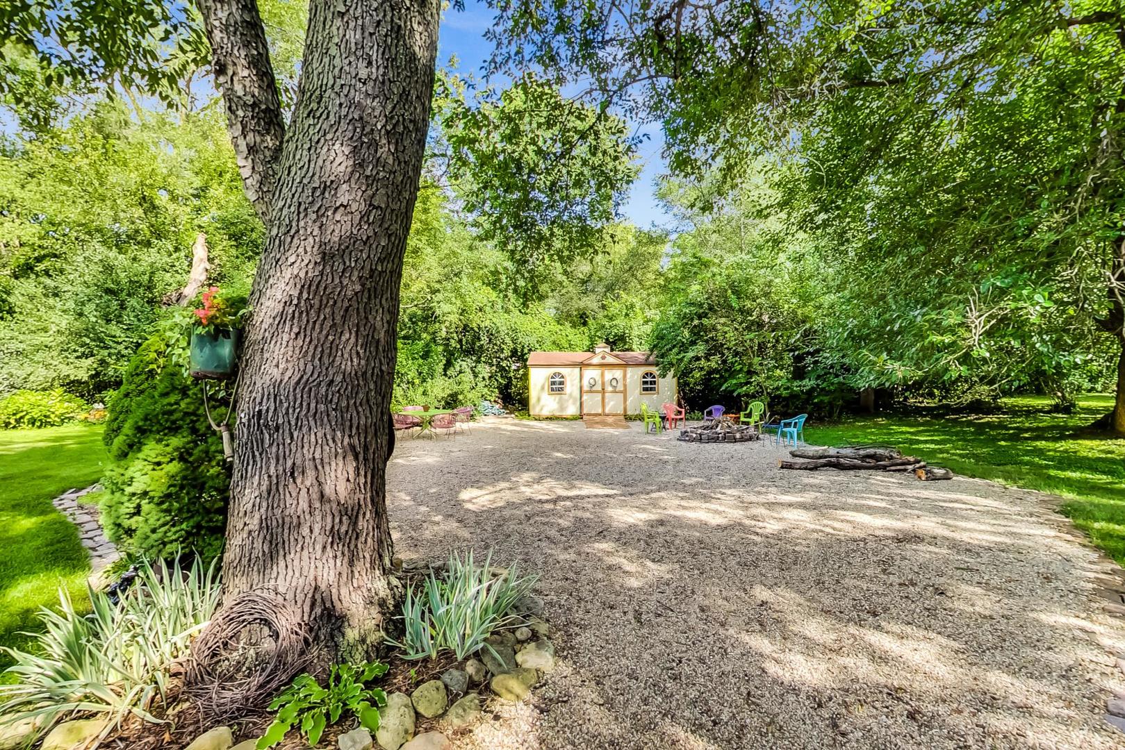 8901 Maple Avenue Burr Ridge, IL 60527 - Photo 60 of 68 a view of a yard with plants and trees