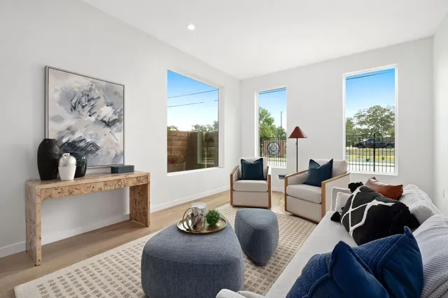 a living room with furniture and a large window