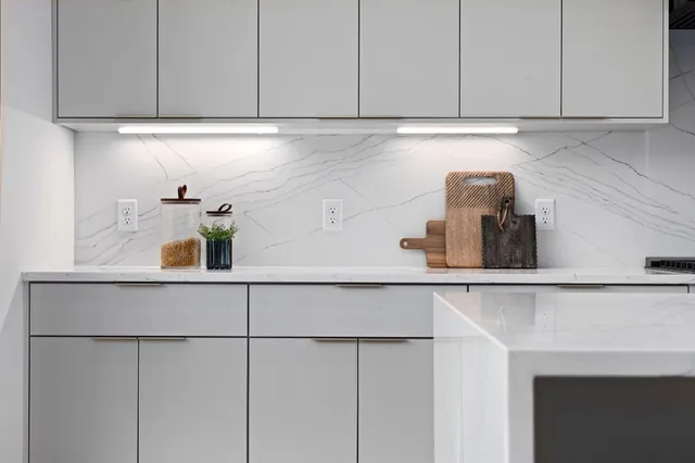 a kitchen with a sink and cabinets