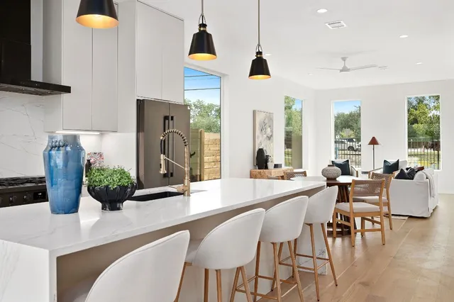 a dining room with furniture and wooden floor