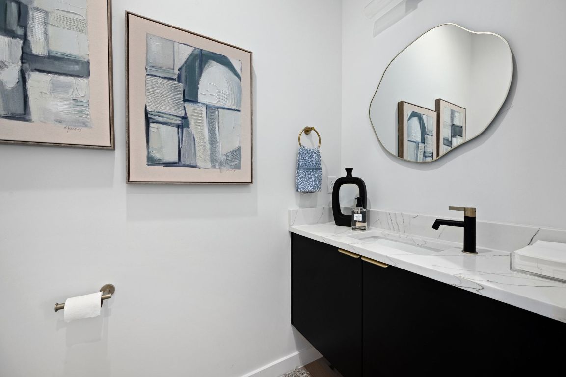 1104 Gunter Street, Unit 1/2 Austin, TX 78702 - Photo 23 of 40 a bathroom with a sink and a mirror