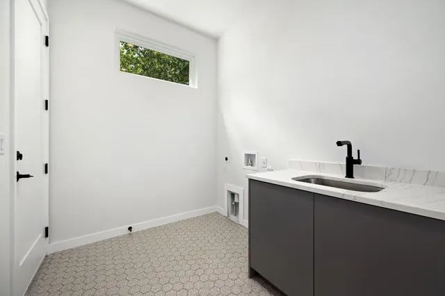 a view of a bathroom with a sink and mirror