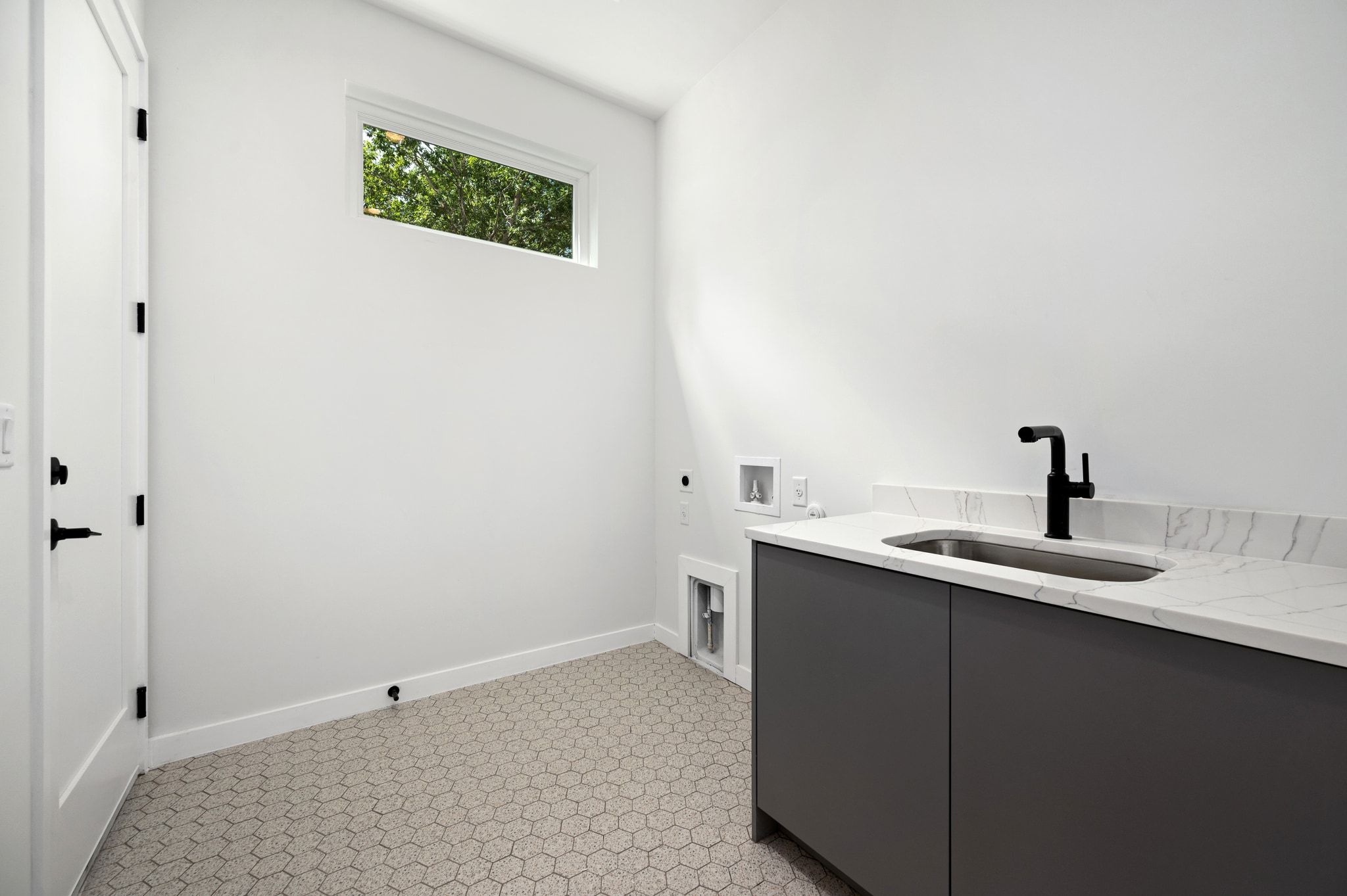 1104 1/2 Gunter Street Austin, TX 78702 - Photo 24 of 40 a view of a bathroom with a sink and mirror