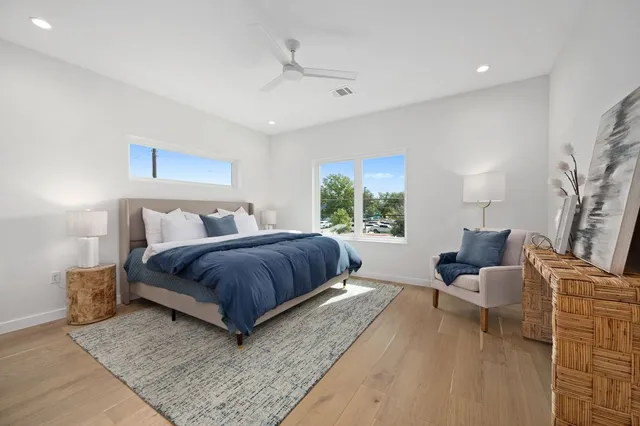 a bedroom with a bed and window