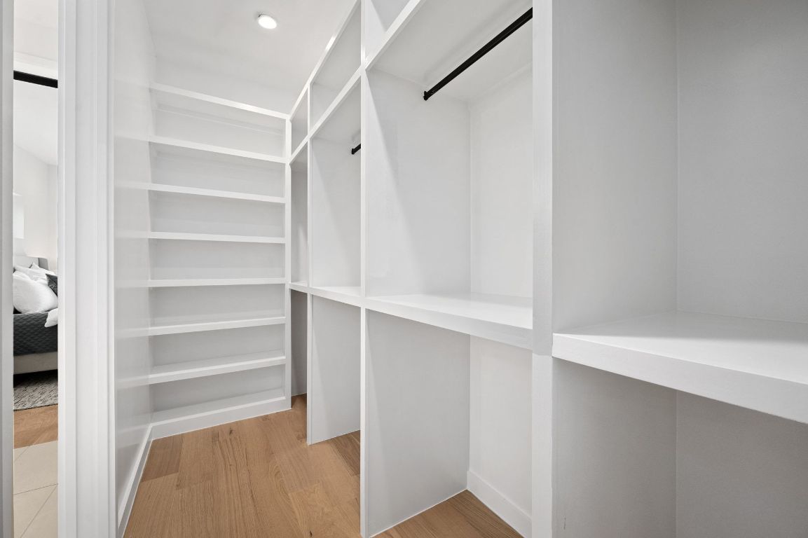 1104 Gunter Street, Unit 1/2 Austin, TX 78702 - Photo 31 of 40 a view of walk in closet with empty racks