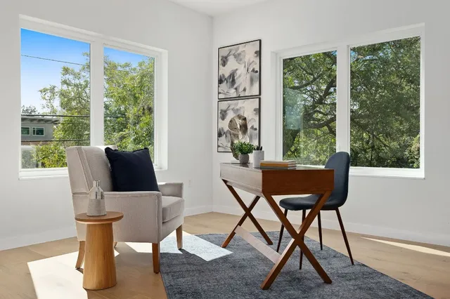 a view of a dining room with furniture window and wooden floor