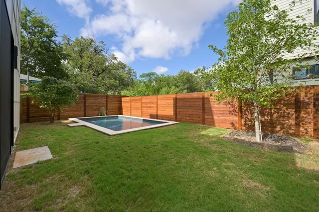 a view of a backyard with a garden