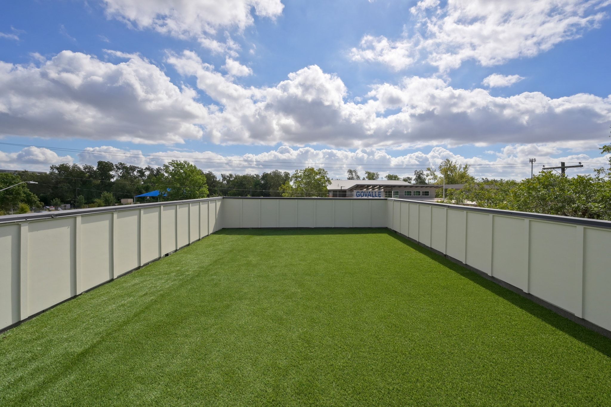 1104 1/2 Gunter Street Austin, TX 78702 - Photo 6 of 40 a view of a backyard with a lake view and covered with trees