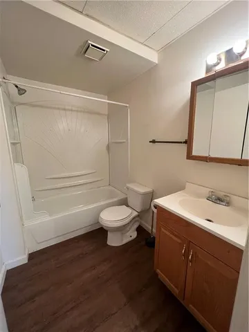 a view of a house with a backyard space