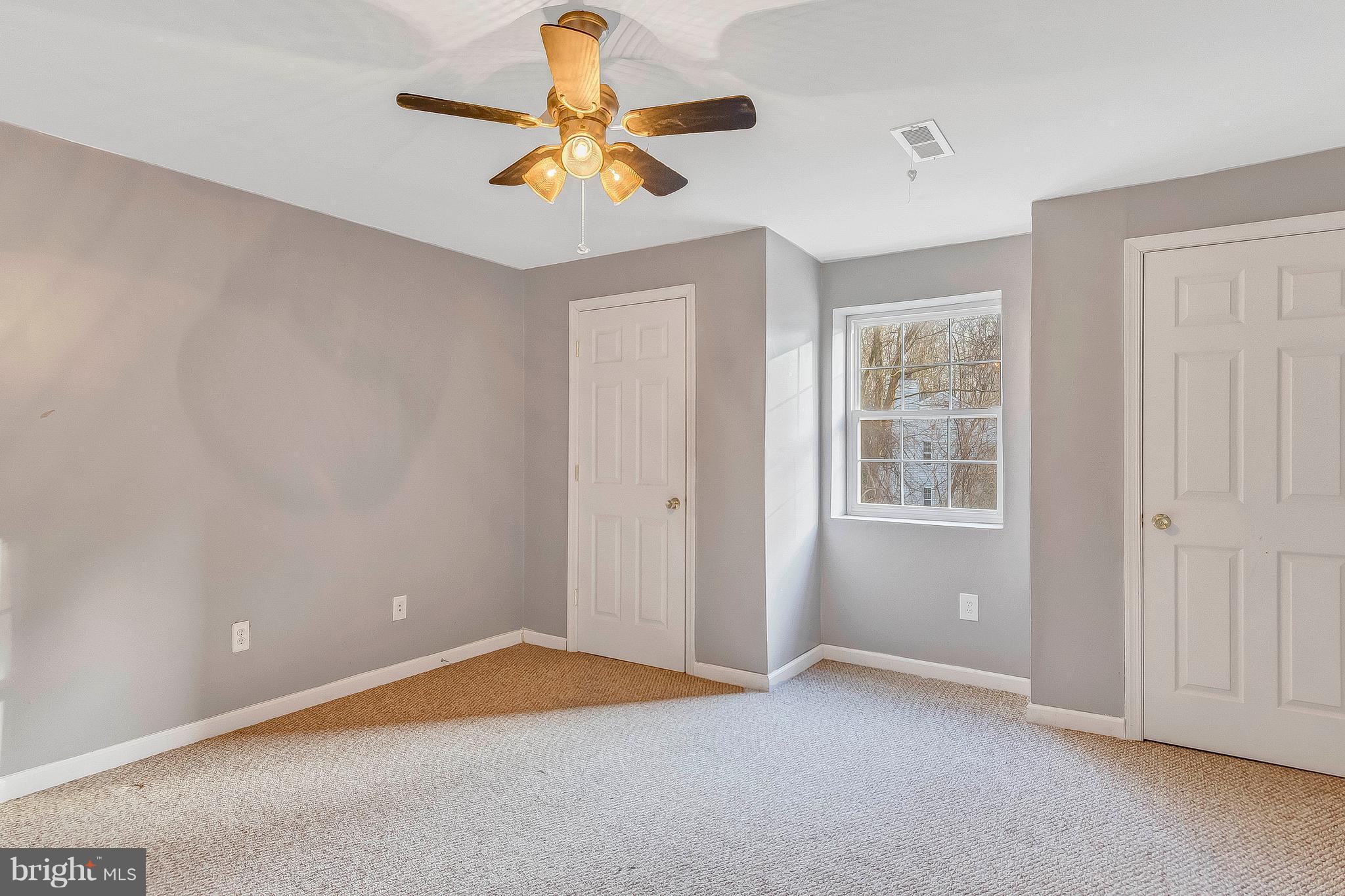 4613 Green Ridge Court Huntingtown, MD 20639 - Photo 25 of 29 Lower level bedroom #1 with ceiling fan