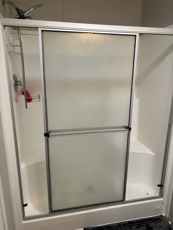 a bathroom with a sink vanity and toilet