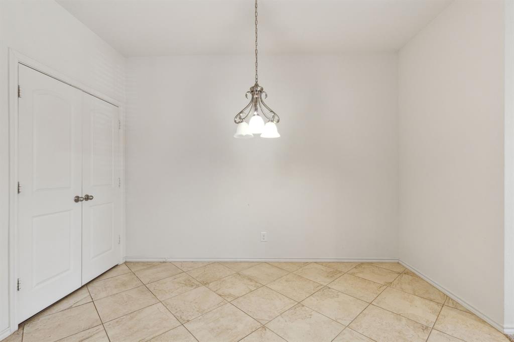 233 Firefly Drive Springtown, TX 76082 - Photo 7 of 16 Dining area featuring chandelier and pantry