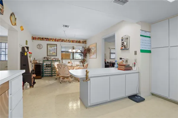 a living room with furniture a window and gym equipment