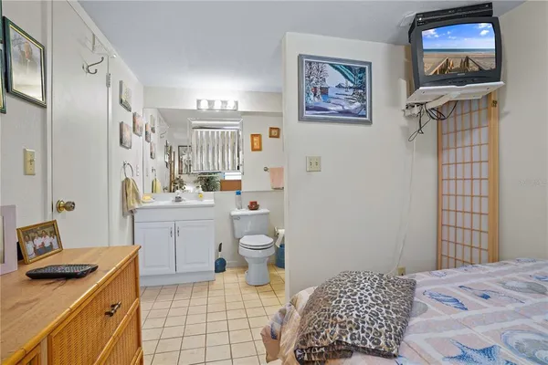 a bedroom with a bed and a cabinets