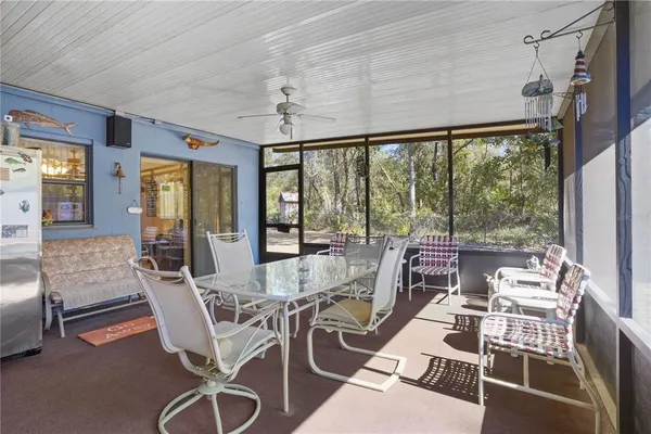 a view of a dining room with furniture wooden floor and chandelier