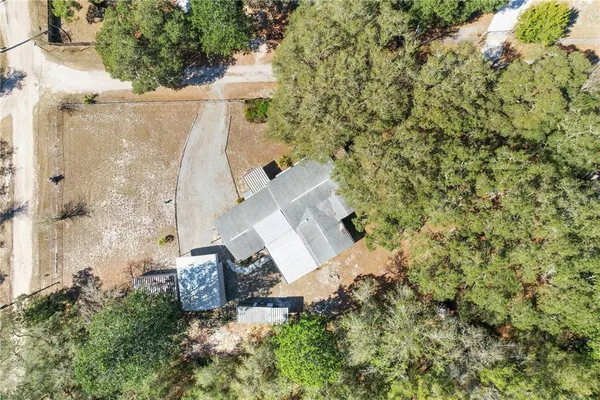 an aerial view of residential house with outdoor space