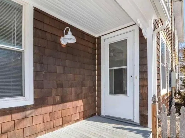 a bathroom with a shower and a window
