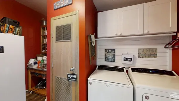 a utility room with dryer and washer