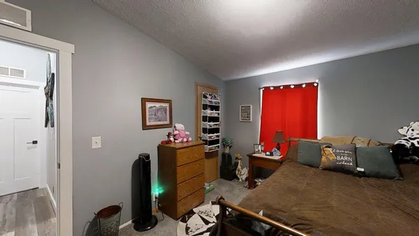 a room with furniture and musical instruments