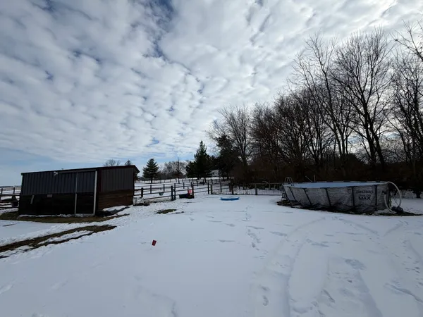 a view of house with car parked
