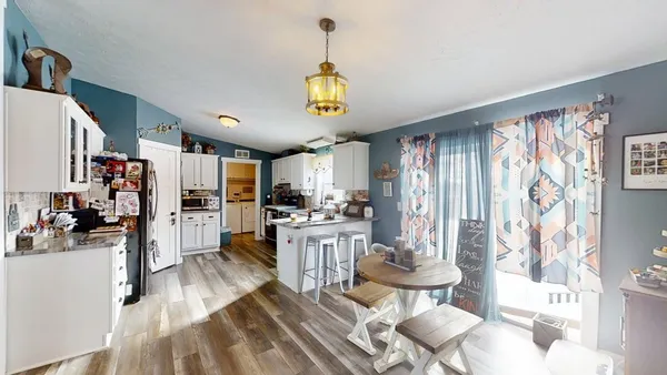 a view of a kitchen and dining room