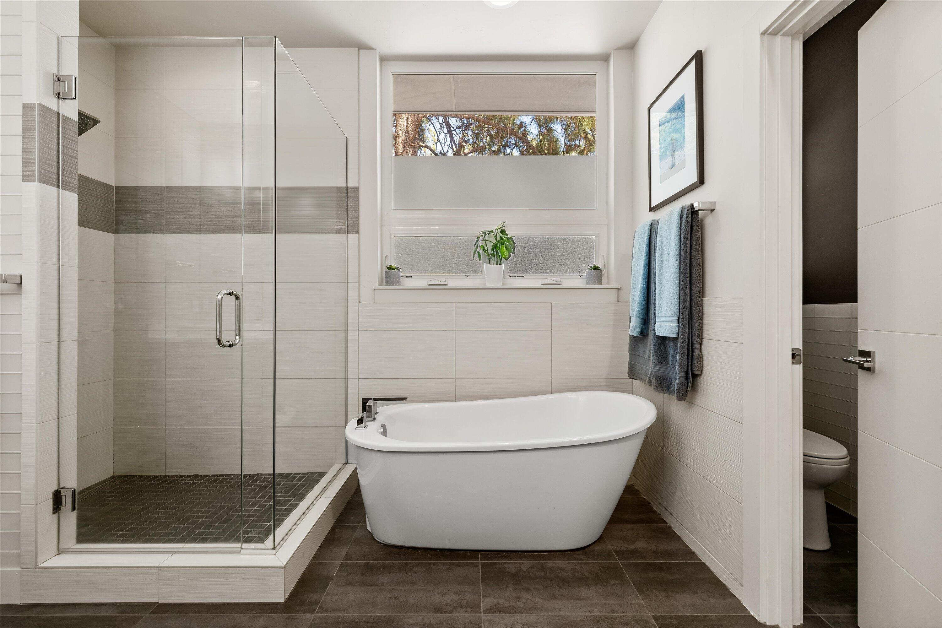 19504 Southwest Century Drive Bend, OR 97702 - Photo 24 of 58 a white bath tub sitting next to a bathroom