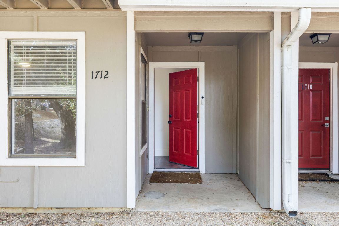 1712 Timber Ridge Road Austin, TX 78741 - Photo 2 of 35 Doorway to property featuring covered porch
