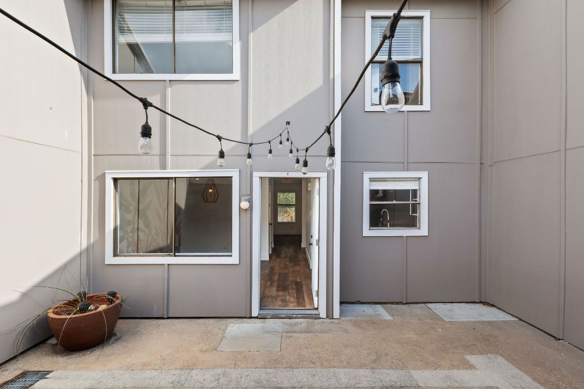 1712 Timber Ridge Road Austin, TX 78741 - Photo 31 of 35 View of exterior entry with a patio